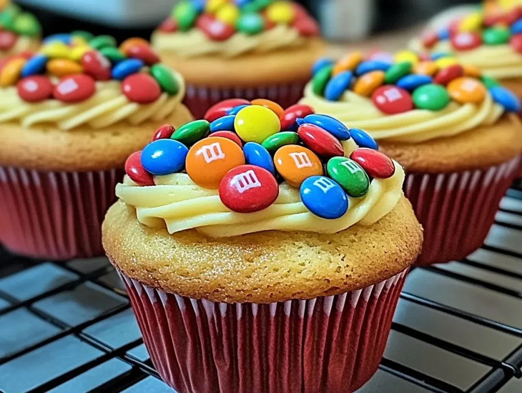 M&M cupcakes recipe, colorful cupcakes with M&M's, easy M&M cupcakes, M&M chocolate cupcakes, fun cupcakes with M&M's.